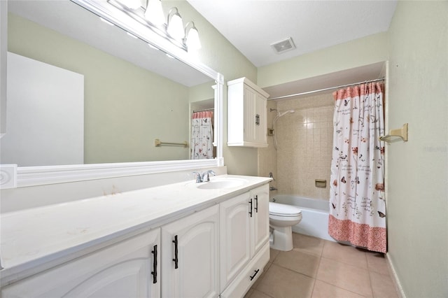 full bathroom with vanity, shower / bath combo with shower curtain, toilet, and tile patterned floors