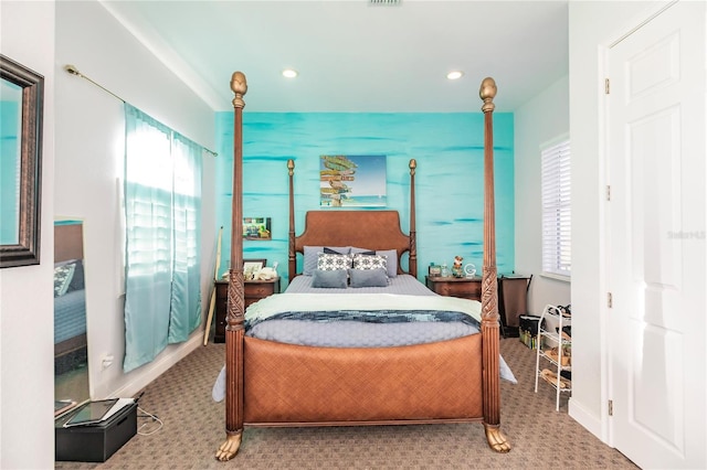 bedroom featuring carpet flooring and multiple windows