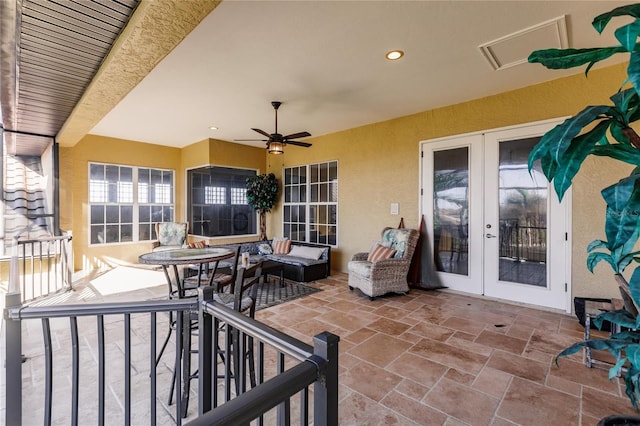 view of patio / terrace featuring french doors, ceiling fan, and outdoor lounge area