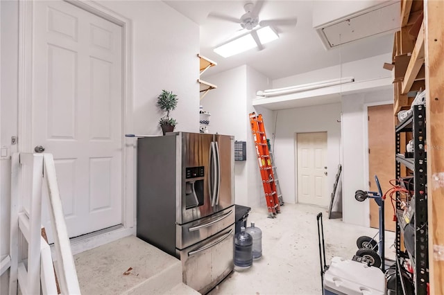 kitchen featuring concrete floors, ceiling fan, and stainless steel fridge with ice dispenser