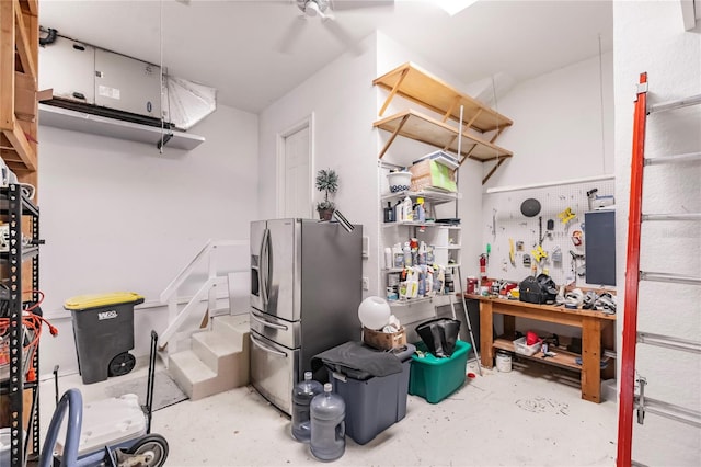 interior space with stainless steel fridge with ice dispenser and concrete floors