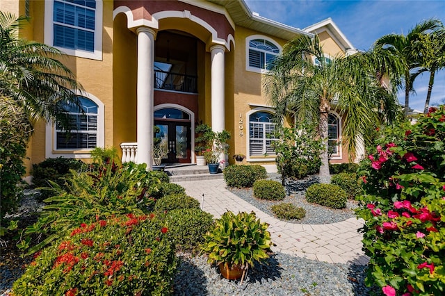 view of exterior entry featuring french doors