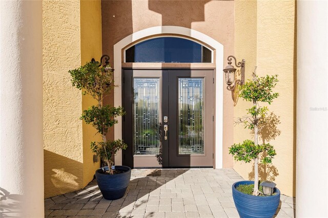 1209 San Mateo Dr, Punta Gorda, FL 33950 - property entrance with stucco siding