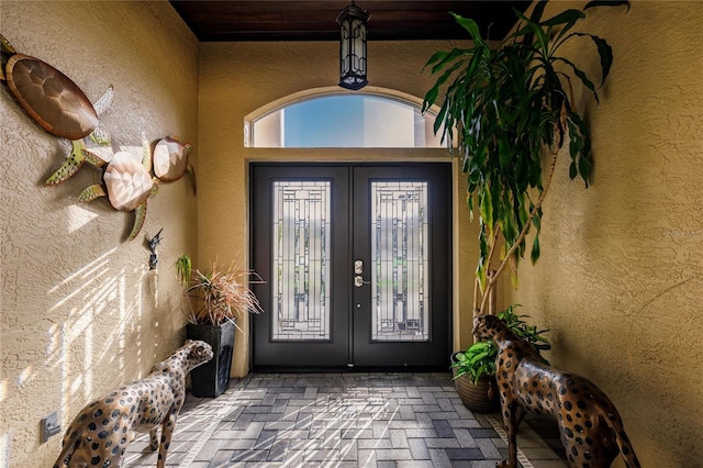 entrance to property featuring french doors