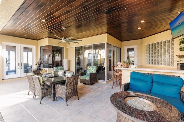 exterior space featuring wood ceiling, french doors, and ceiling fan