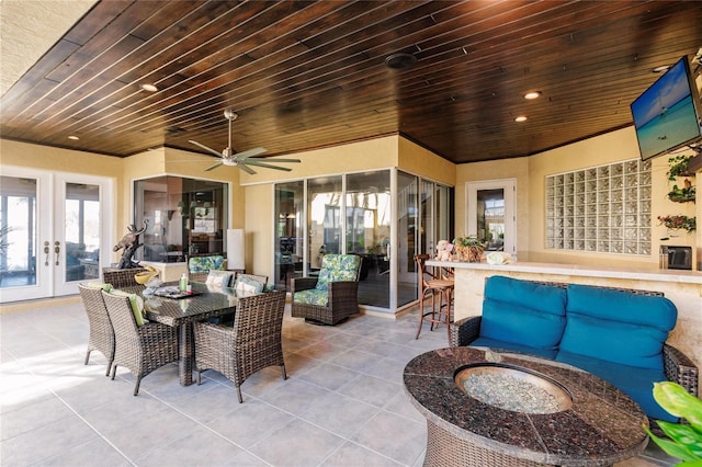 1209 San Mateo Dr, Punta Gorda, FL 33950 - view of patio / terrace featuring french doors, outdoor lounge area, ceiling fan, and outdoor dining space