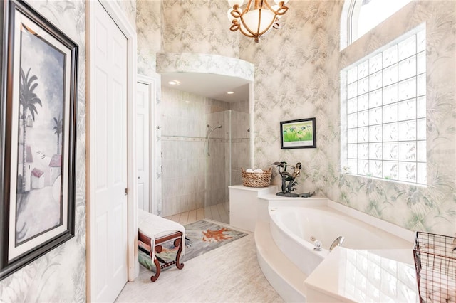 1209 San Mateo Dr, Punta Gorda, FL 33950 - full bathroom featuring wallpapered walls, walk in shower, a tub with jets, healthy amount of natural light, and tile patterned floors