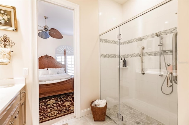 bathroom featuring vanity, an enclosed shower, tile patterned floors, and ceiling fan