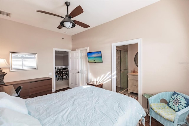 bedroom featuring wood-type flooring, connected bathroom, and ceiling fan