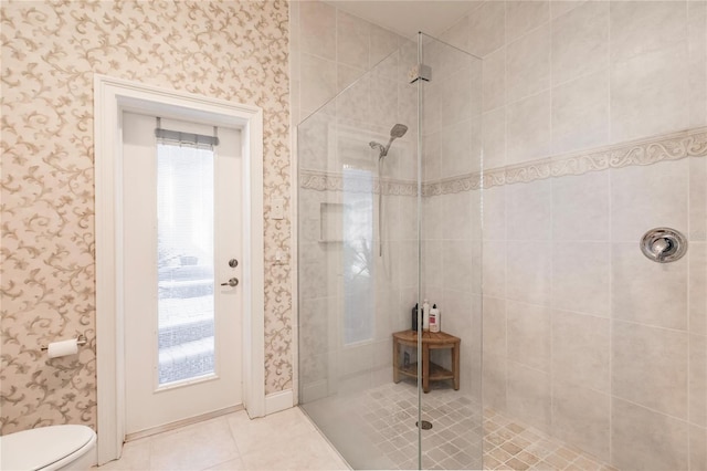 1209 San Mateo Dr, Punta Gorda, FL 33950 - bathroom with tiled shower, wallpapered walls, toilet, and tile patterned flooring