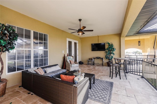 view of patio / terrace featuring french doors, outdoor lounge area, and ceiling fan