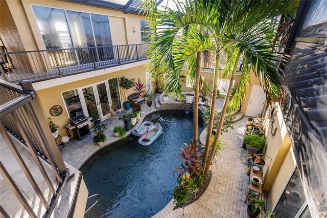1209 San Mateo Dr, Punta Gorda, FL 33950 - outdoor pool featuring french doors, a hot tub, and a patio area