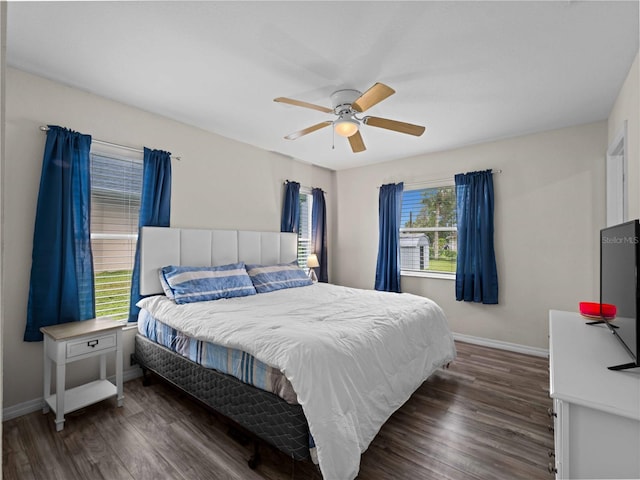 bedroom featuring dark hardwood / wood-style flooring and ceiling fan