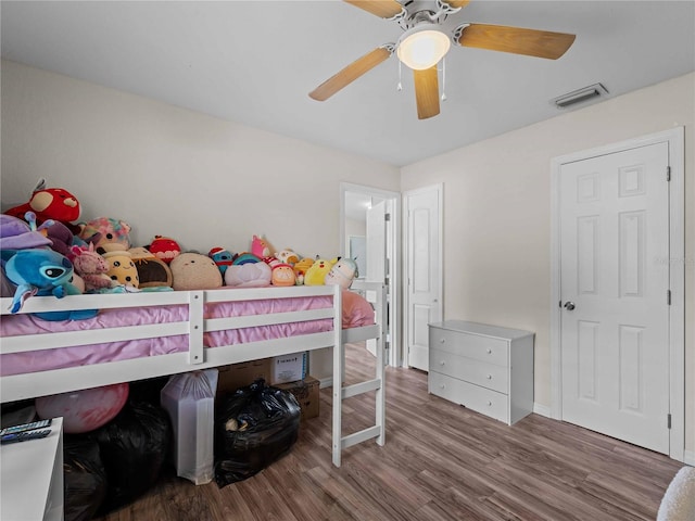 bedroom featuring ceiling fan and hardwood / wood-style flooring