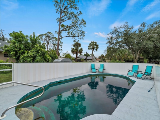 view of pool featuring a patio area