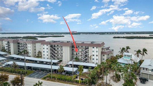 birds eye view of property with a water view