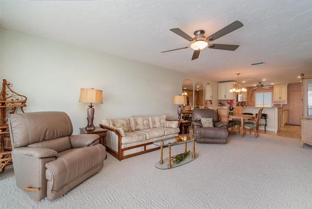 9011 Midnight Pass Rd Unit 329, Sarasota, FL 34242 - living area featuring a ceiling fan, a chandelier, and light carpet