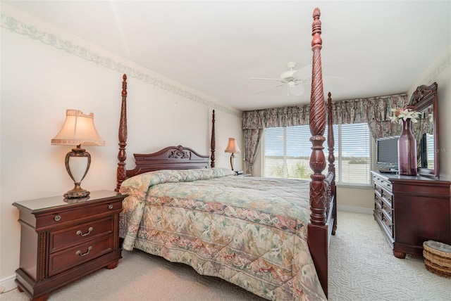 bedroom featuring light colored carpet and ceiling fan