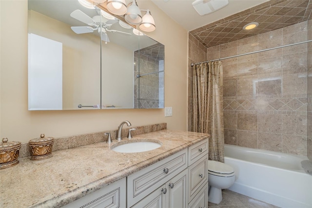 full bathroom with vanity, shower / bath combo with shower curtain, toilet, and ceiling fan