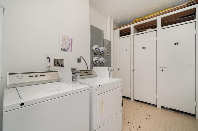9011 Midnight Pass Rd Unit 329, Sarasota, FL 34242 - shared laundry room with washing machine and dryer and electric panel