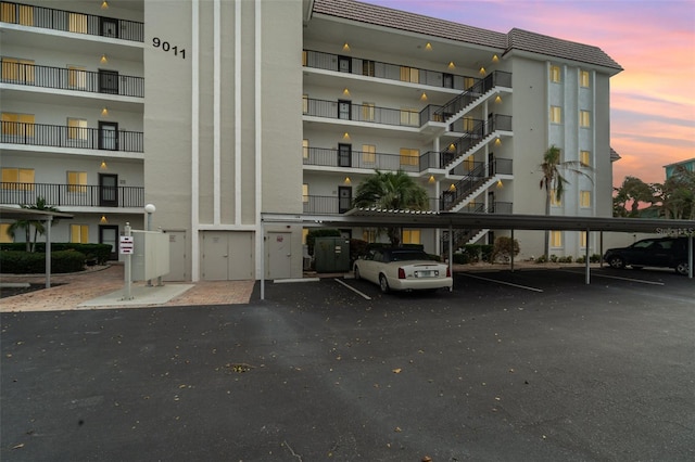 view of outdoor building at dusk