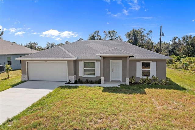 single story home featuring a front yard and a garage