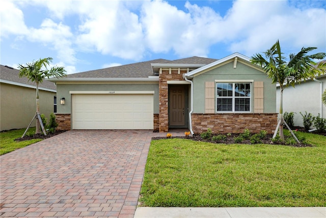 view of front of house featuring a front yard and a garage