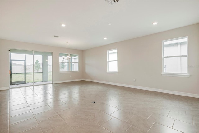 spare room with light tile patterned floors