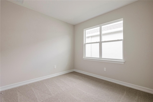 empty room with carpet flooring