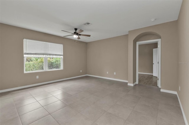 unfurnished room featuring light tile patterned floors and ceiling fan