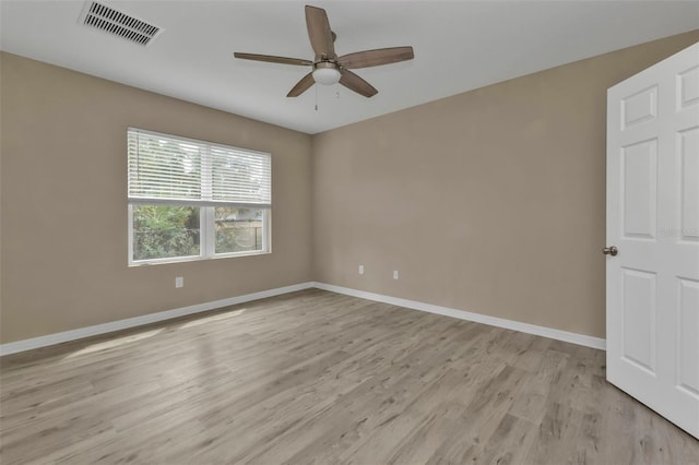 unfurnished room featuring light hardwood / wood-style floors and ceiling fan