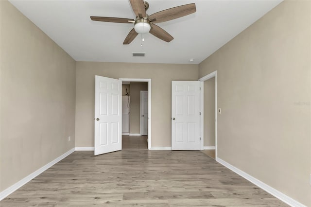 unfurnished bedroom featuring light hardwood / wood-style flooring and ceiling fan