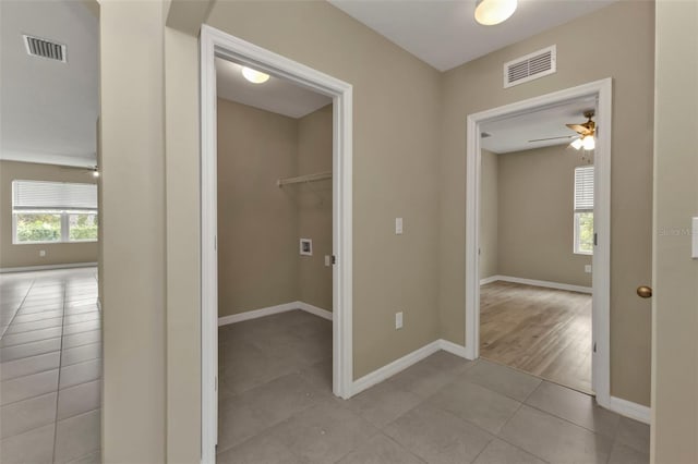 hallway with light tile patterned floors