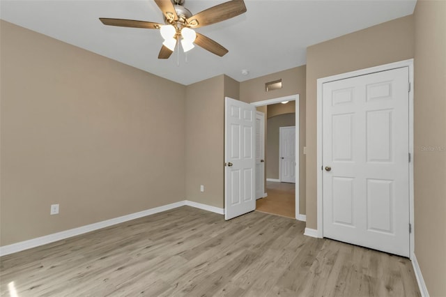 unfurnished bedroom featuring light hardwood / wood-style floors and ceiling fan