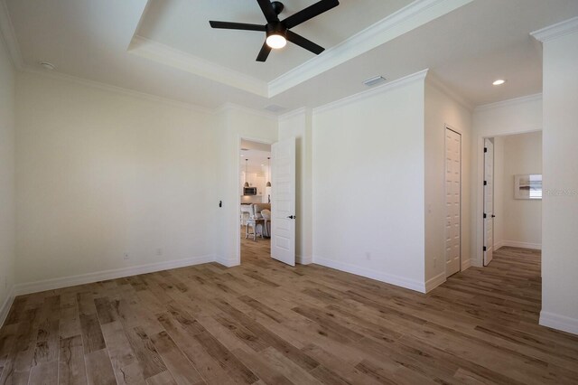14294 Mcfarland Ave, Port Charlotte, FL 33981 - spare room featuring recessed lighting, a ceiling fan, visible vents, ornamental molding, and wood finished floors