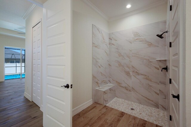 14294 Mcfarland Ave, Port Charlotte, FL 33981 - bathroom with wood finished floors, crown molding, recessed lighting, and tiled shower