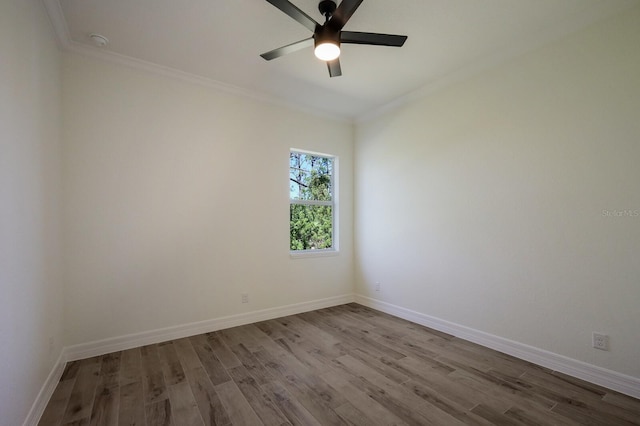 empty room with crown molding, light hardwood / wood-style floors, and ceiling fan