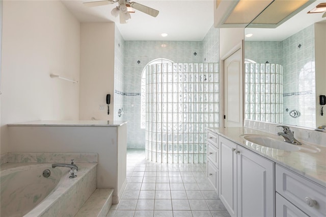 bathroom featuring independent shower and bath, vanity, tile patterned flooring, and ceiling fan