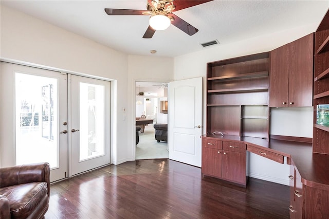 interior space with ceiling fan, dark hardwood / wood-style flooring, and french doors