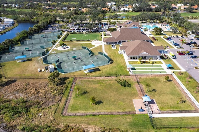 birds eye view of property with a water view