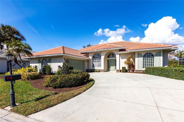 mediterranean / spanish house featuring a garage