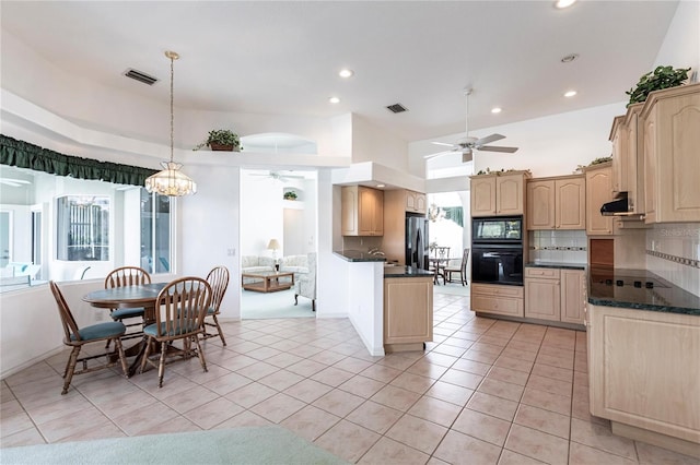 kitchen featuring extractor fan, decorative light fixtures, ceiling fan with notable chandelier, decorative backsplash, and black appliances