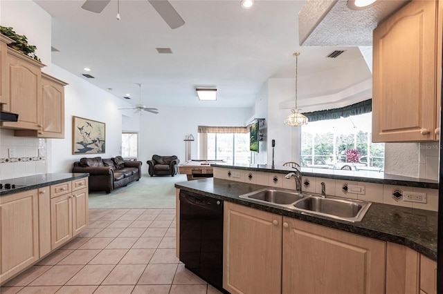 kitchen featuring sink, pendant lighting, light brown cabinetry, and black appliances