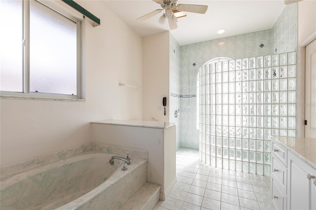 bathroom with vanity, tile patterned floors, plus walk in shower, and ceiling fan