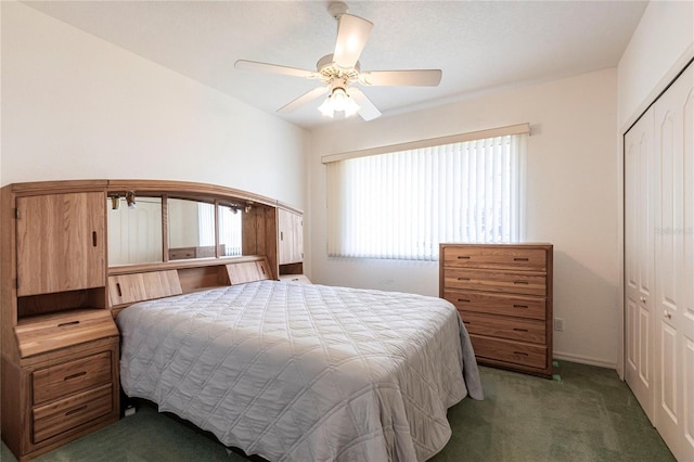 carpeted bedroom featuring ceiling fan and a closet