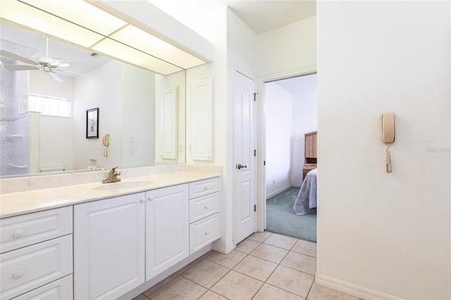 bathroom featuring tile patterned flooring, vanity, ceiling fan, and toilet