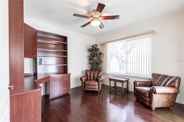 sitting room featuring dark hardwood / wood-style flooring and ceiling fan