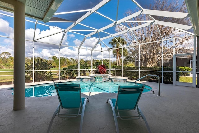 view of swimming pool featuring an in ground hot tub, a lanai, and a patio