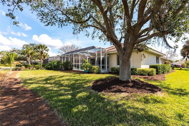 view of yard featuring a lanai