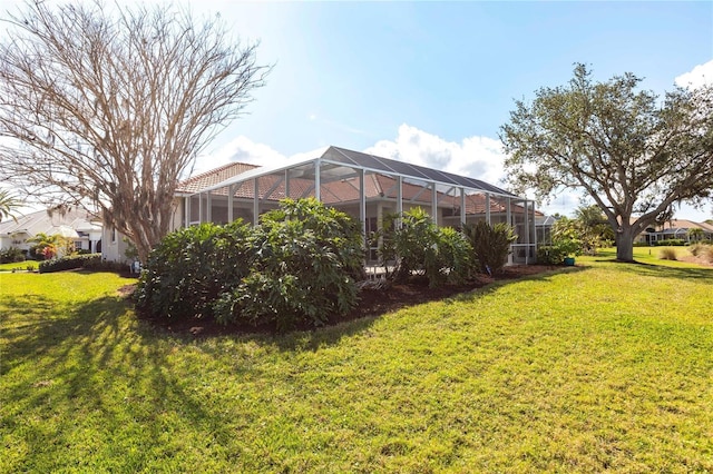 view of yard featuring a lanai